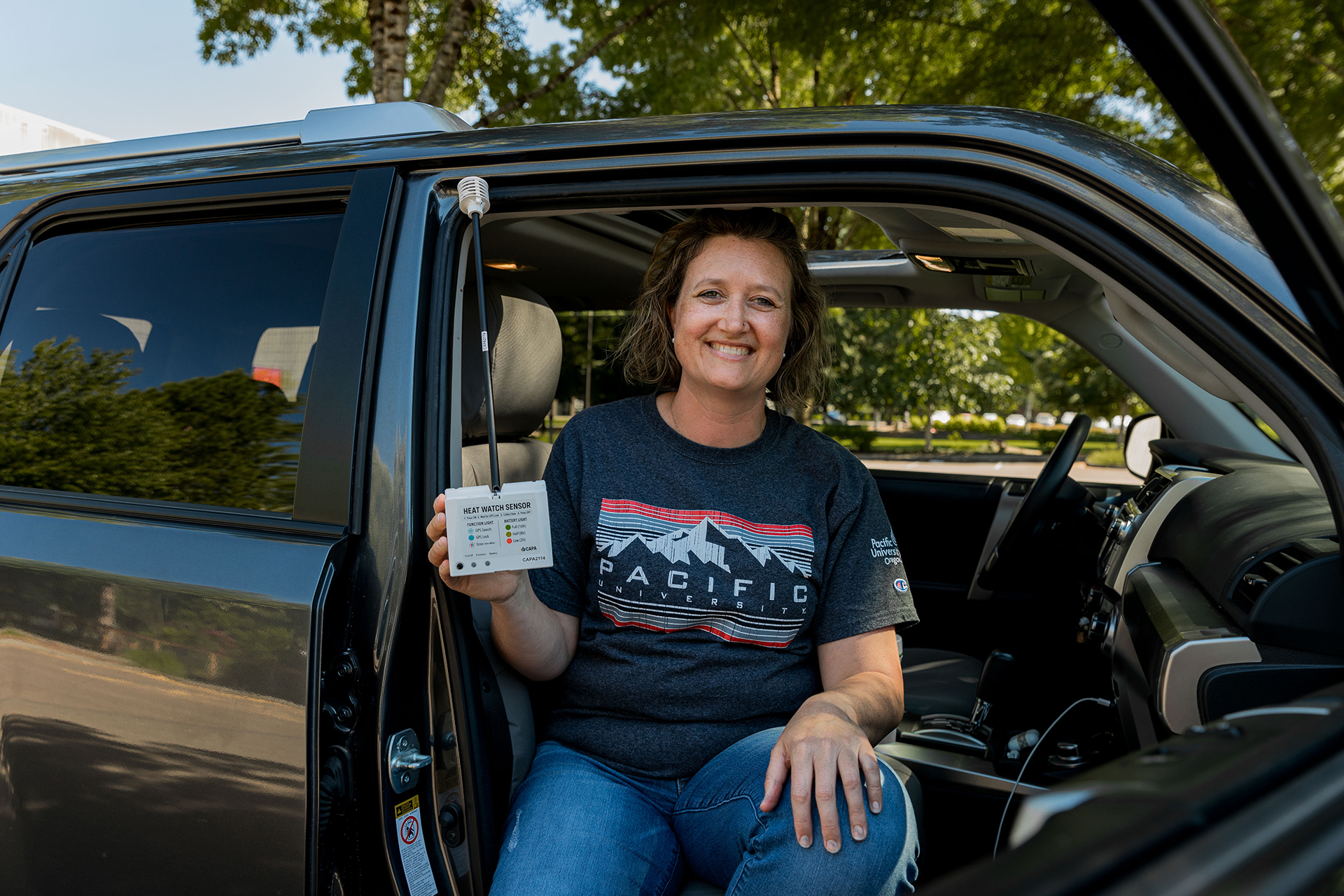 Public health student Kylie Hepler '25 displays a heat sensor she'll use as a street scientist