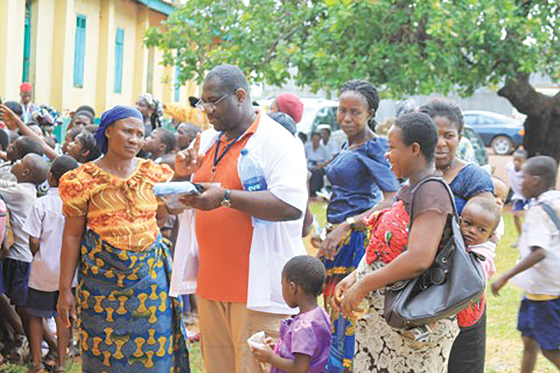 Dr. Agbo Conducting work within a crowd in West Africa