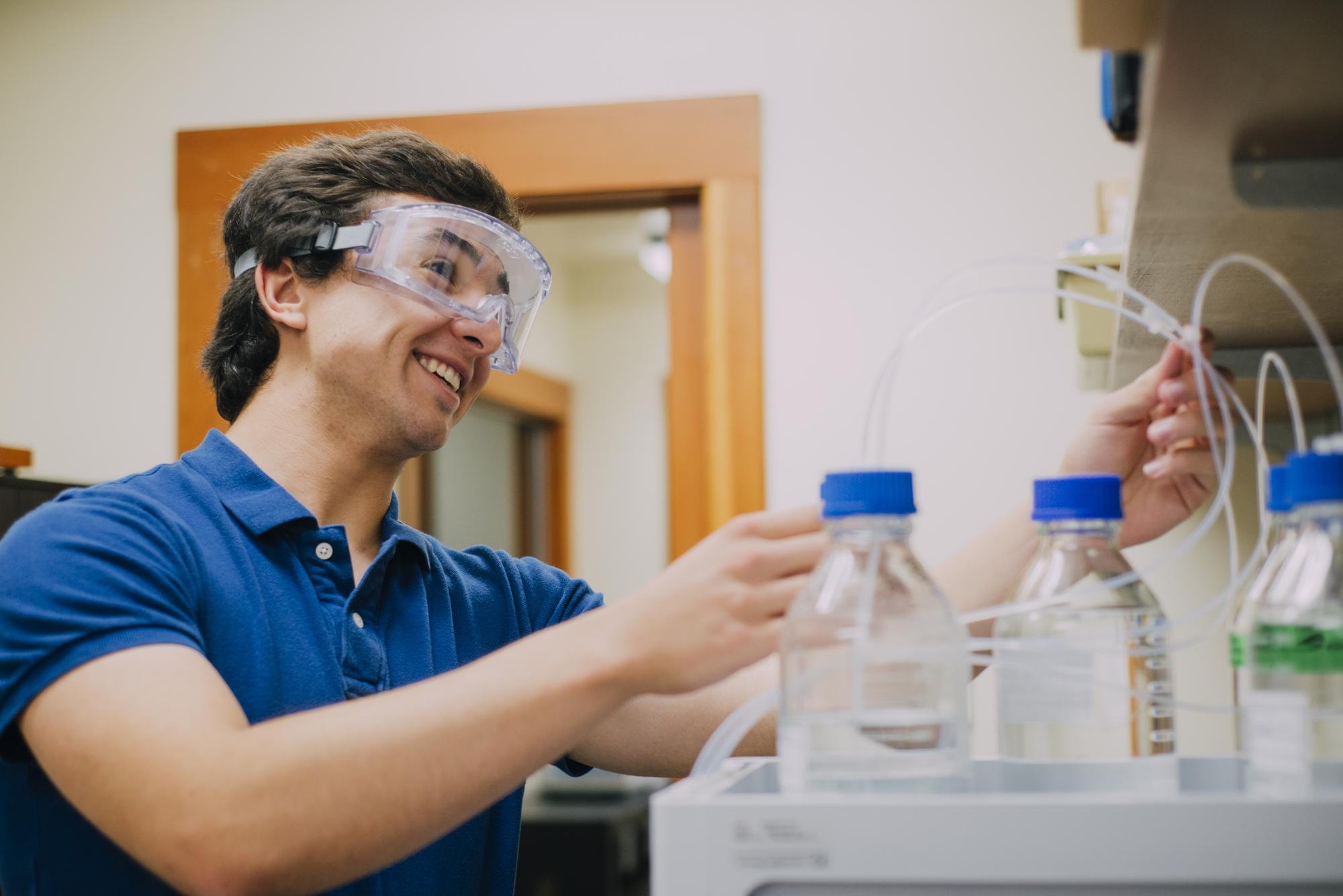 Student with Liquid Chromatograph