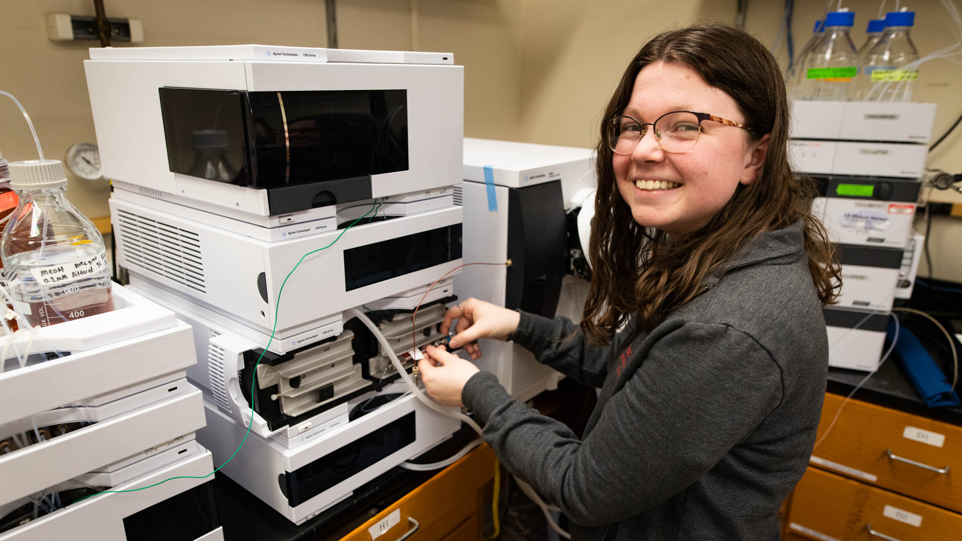 Student with Liquid Chromatograph