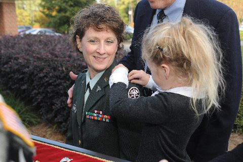 woman and child in military uniform