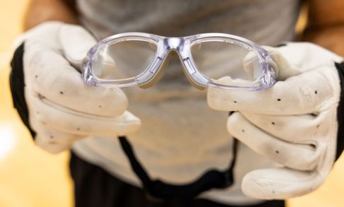 Someone holding eyewear
