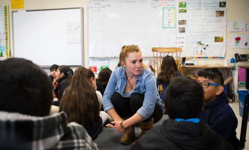 Fallon Harris '14 with students at Cornelius Elementary