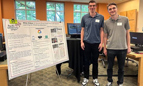Cayden Wagner '24 (right) and James Corety '24 with their poster presentation on Wise Inbox at the 2024 Senior Projects Day.