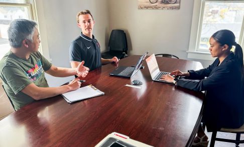 Two Business Students Working With Owner Of Telvet Coffee