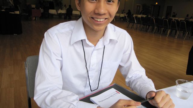 A Pacific University student prepares to talk to employers at a school-sponsored career networking event.