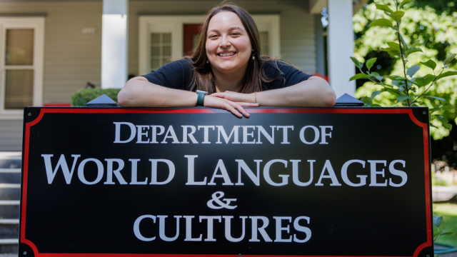 Fulbright Scholar Anjolina Horzynek '22 stands in front of the World Languages & Cultures building