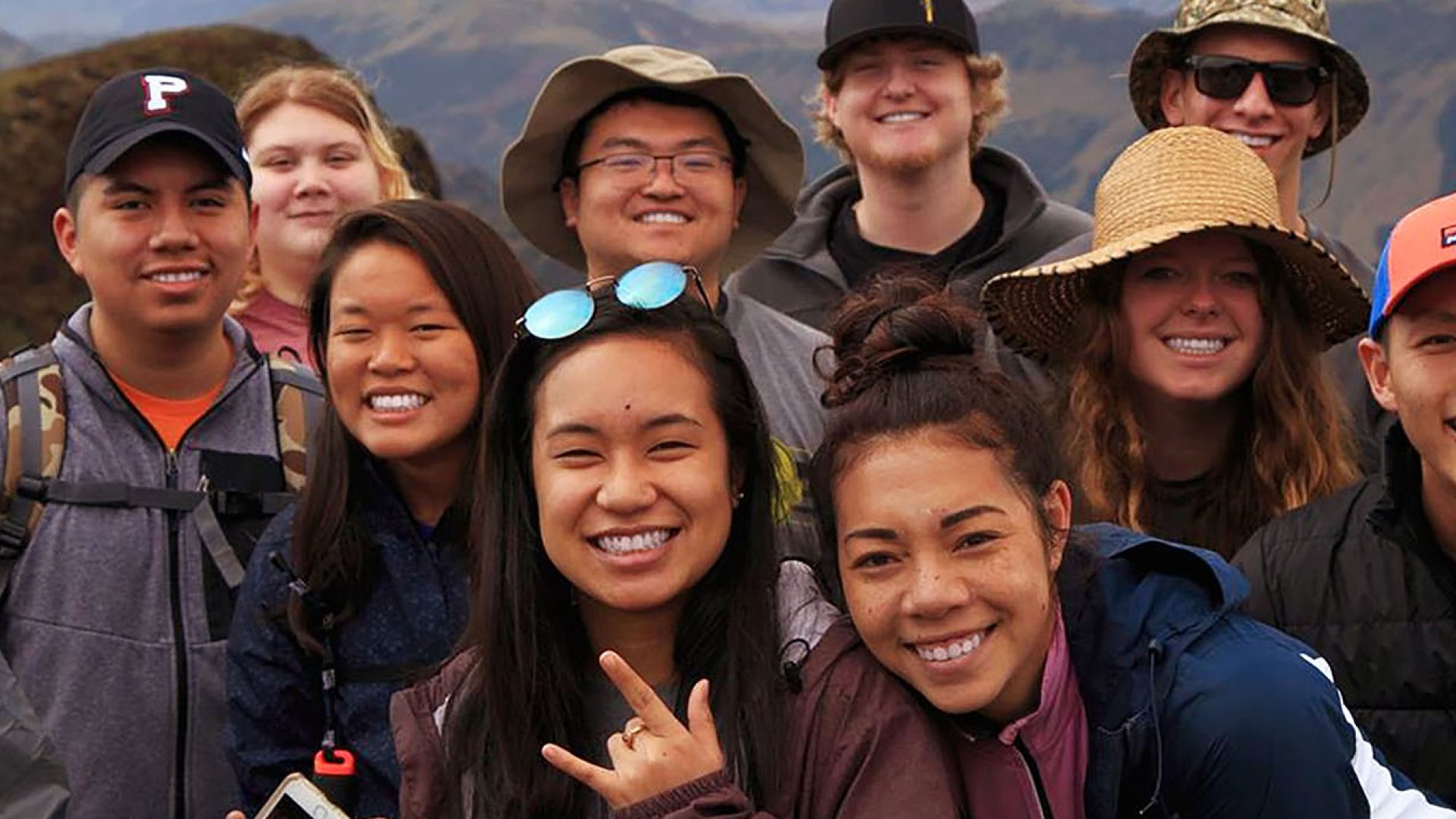 Students posing for a picture while hiking